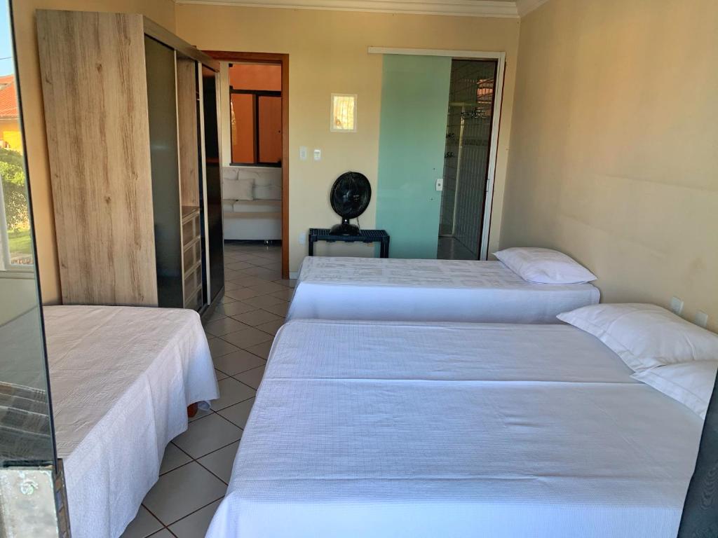 En eller flere senger på et rom på Hostel Da Jô