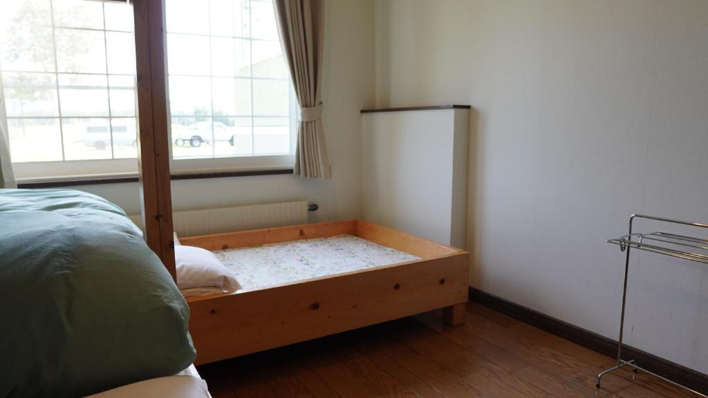 Postel nebo postele na pokoji v ubytování Kiyosato IHATOV Hostel