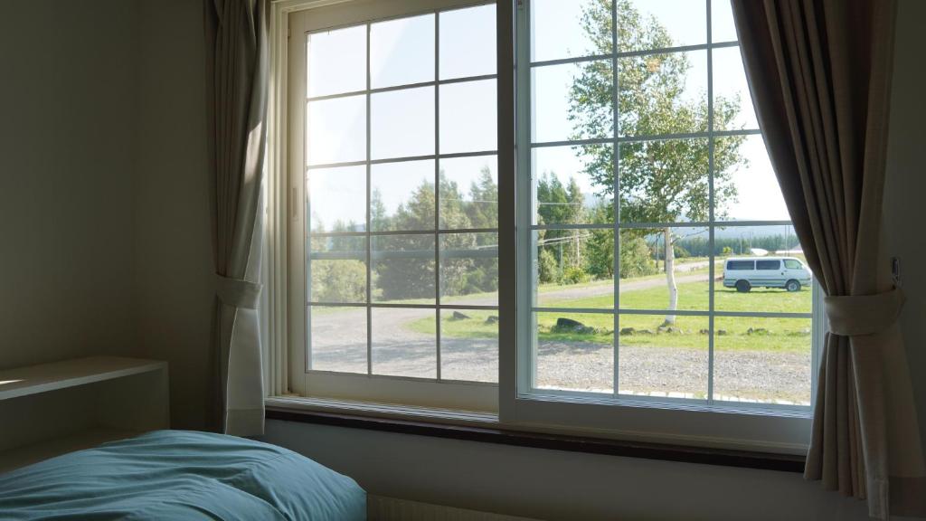 Postel nebo postele na pokoji v ubytování Kiyosato IHATOV Hostel
