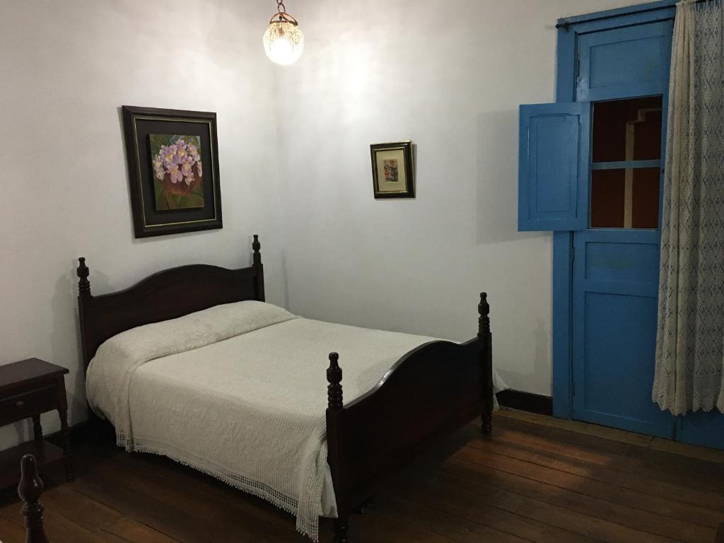 Llit o llits en una habitació de Casa Hotel El Compadre