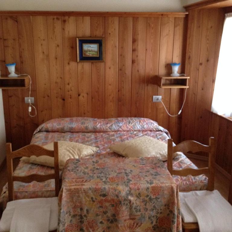 Postel nebo postele na pokoji v ubytování Albergo Del Ponte