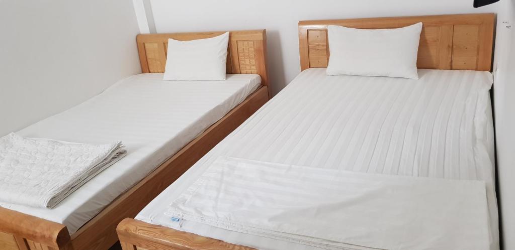 Postel nebo postele na pokoji v ubytování Anh Duong Hotel