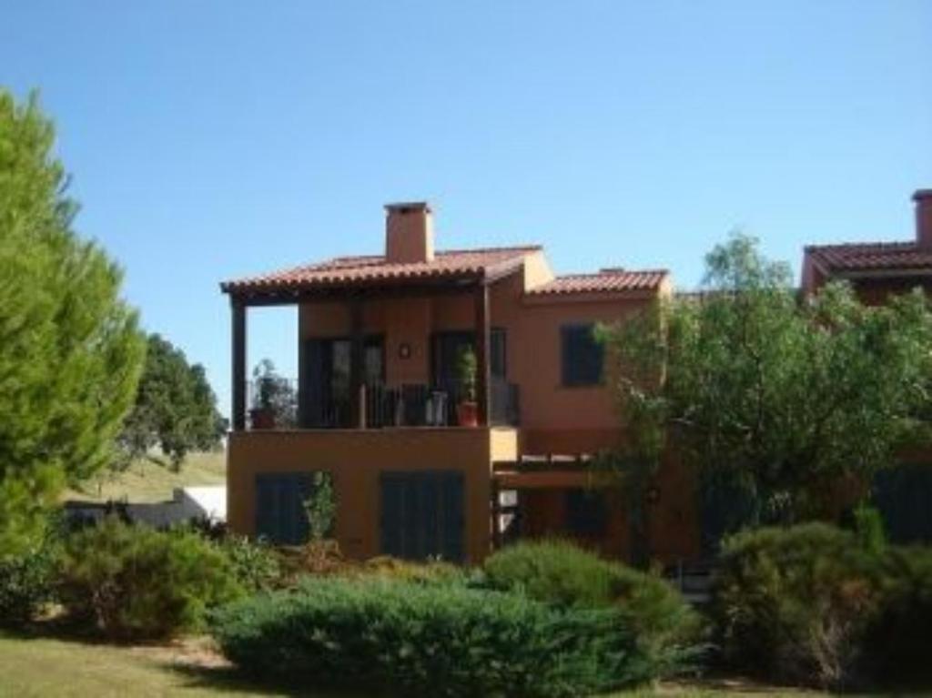 a large house in the middle of a yard at Casa bonmont con vistas al mar piscina y port aventura in Cambrils