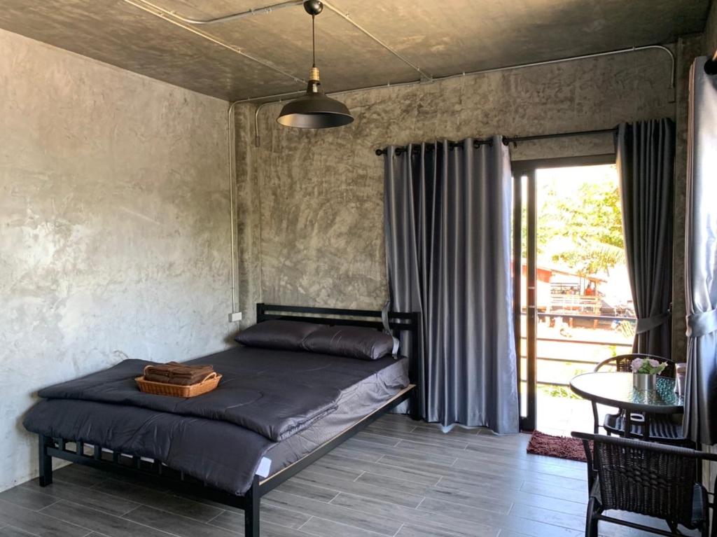 Postel nebo postele na pokoji v ubytování Somphoch Garden