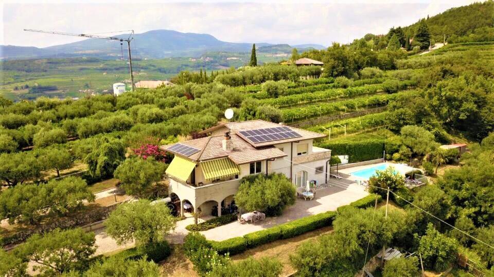 an aerial view of a house with a solar roof at Valpolicella Hills in Negrar