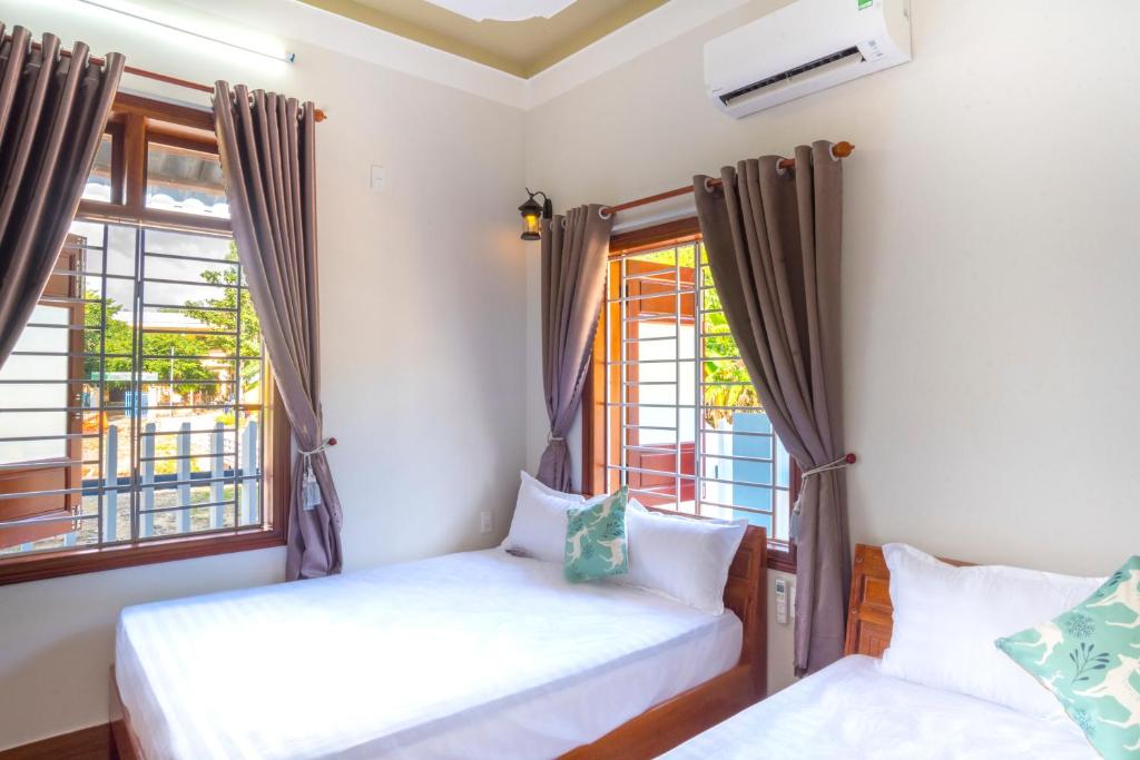Postel nebo postele na pokoji v ubytování Cong Man Homestay Cham Island