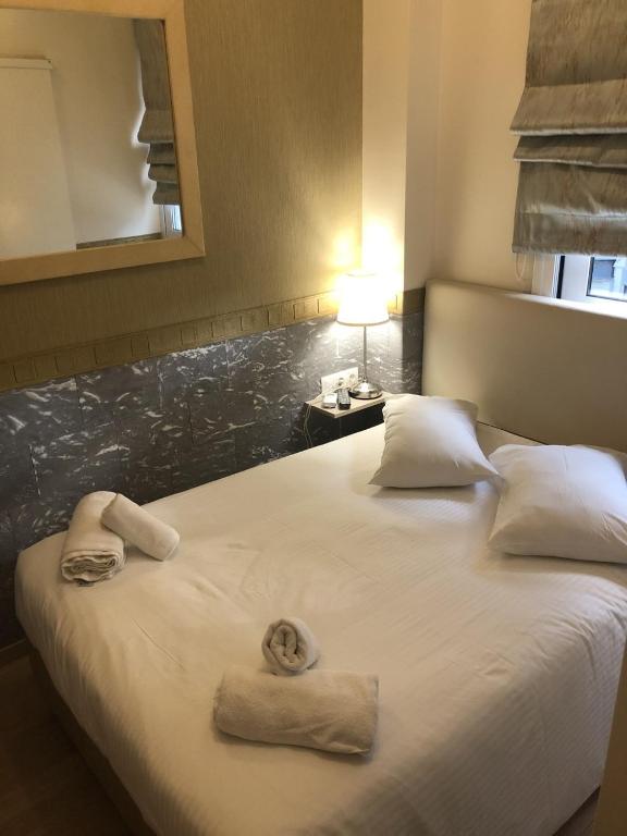 Uma cama ou camas num quarto em Phidias Hotel by Oniro