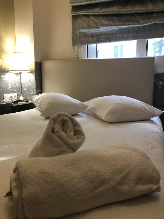 Uma cama ou camas num quarto em Phidias Hotel by Oniro