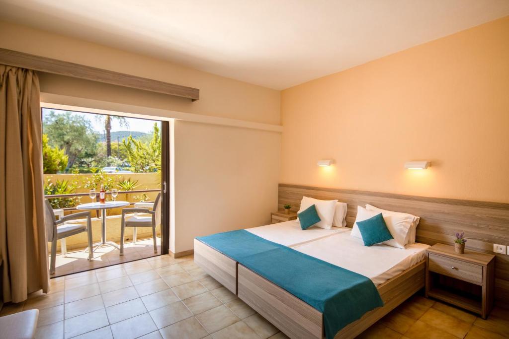 Postel nebo postele na pokoji v ubytování Hotel Rossis