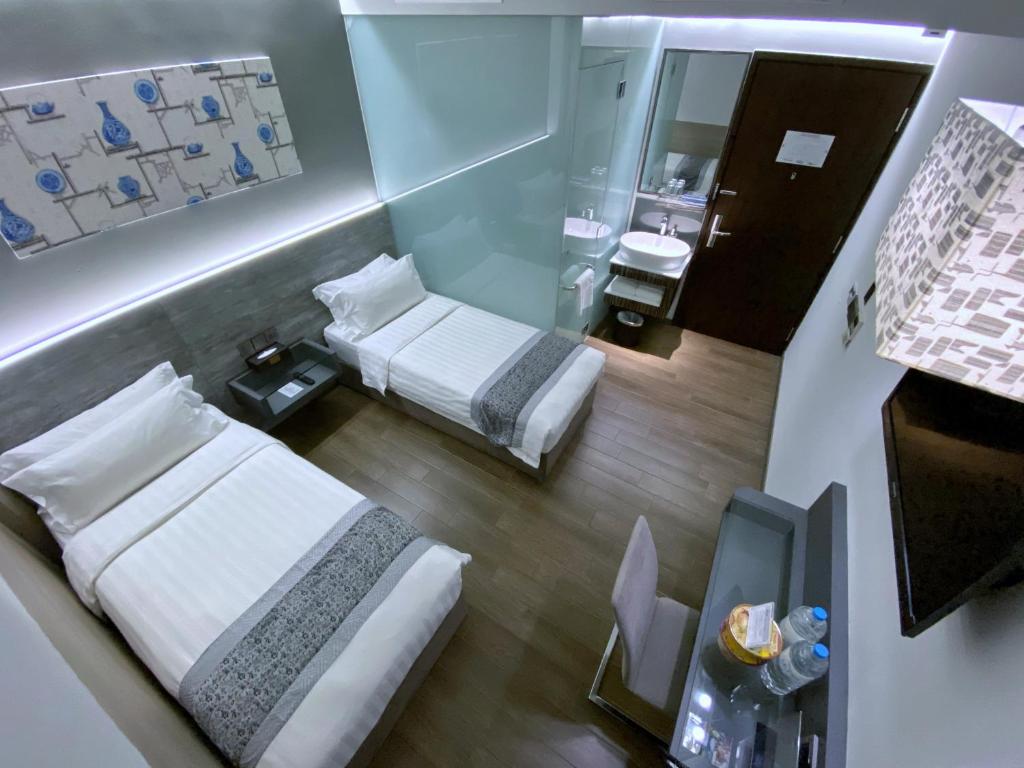 Bliss Hotel Singaporeにあるベッド