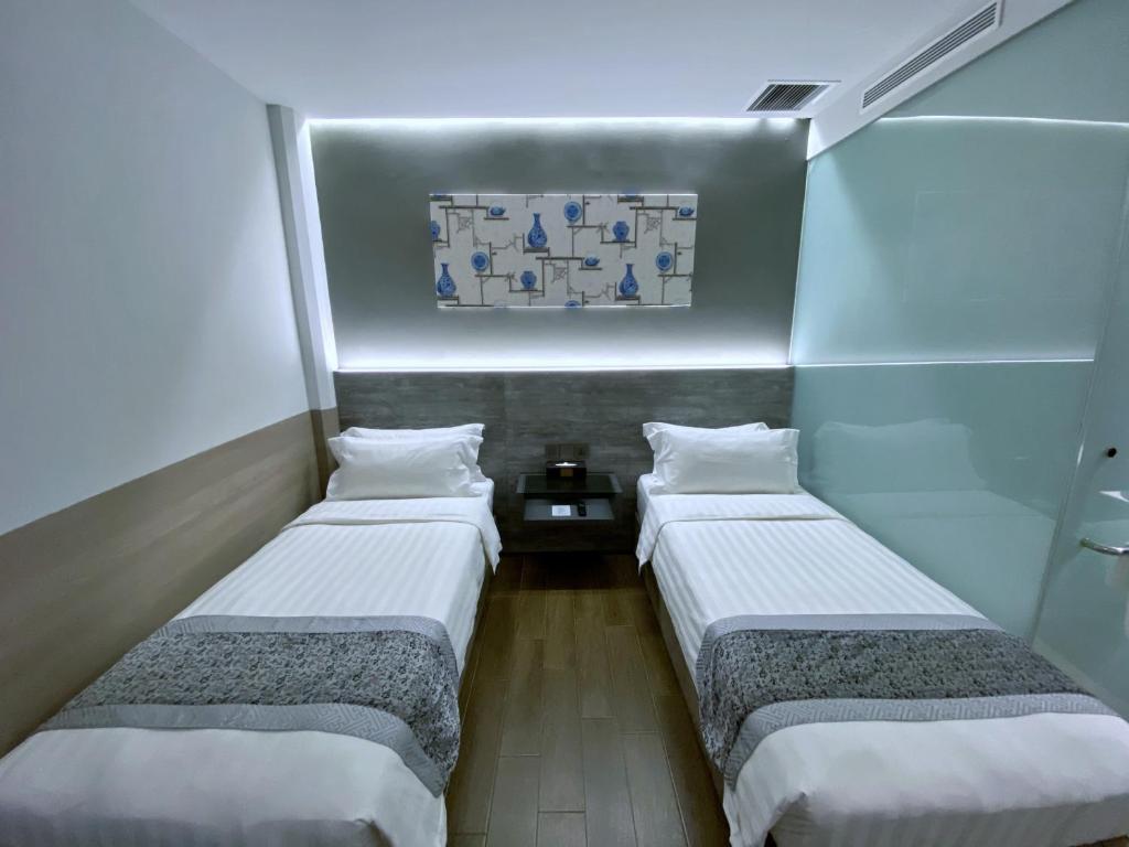 Bliss Hotel Singaporeにあるベッド