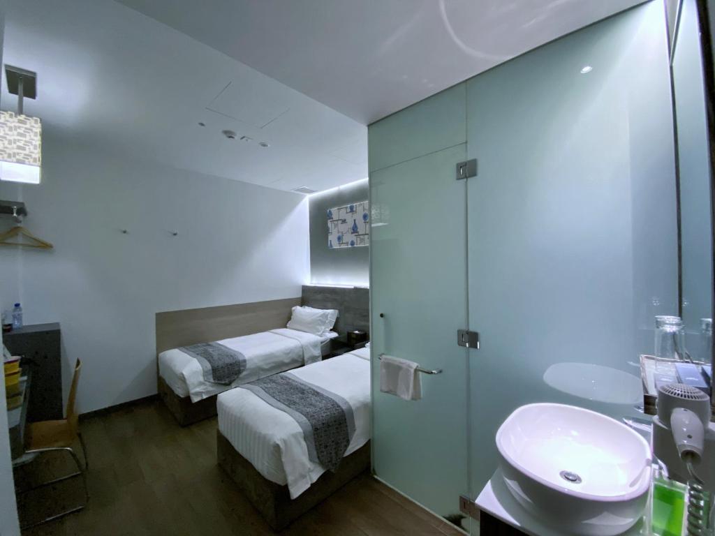 Bliss Hotel Singaporeにあるベッド