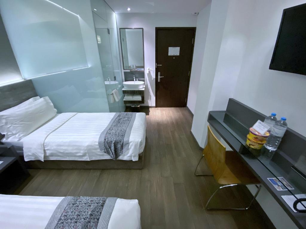 Bliss Hotel Singaporeにあるテレビまたはエンターテインメントセンター