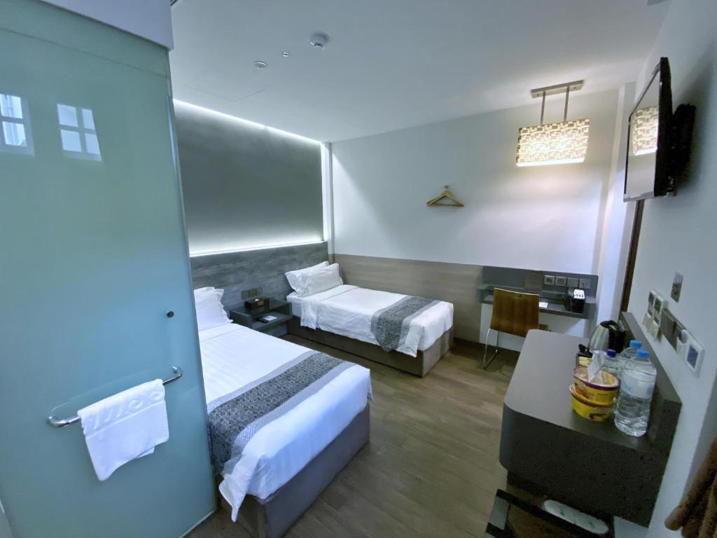 Bliss Hotel Singaporeにあるベッド