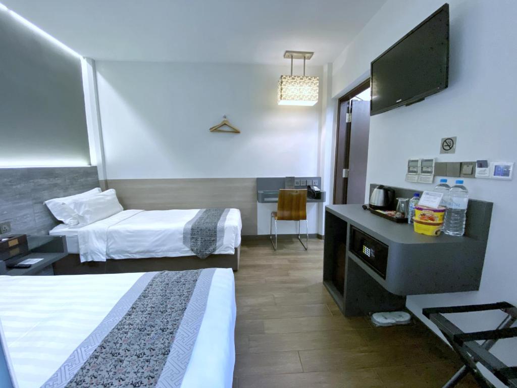 Bliss Hotel Singaporeにあるベッド