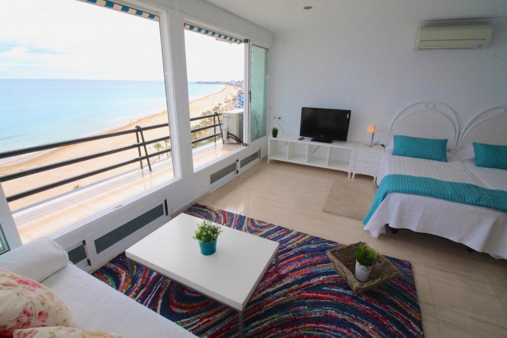 A bed or beds in a room at Loft Playa Muchavista