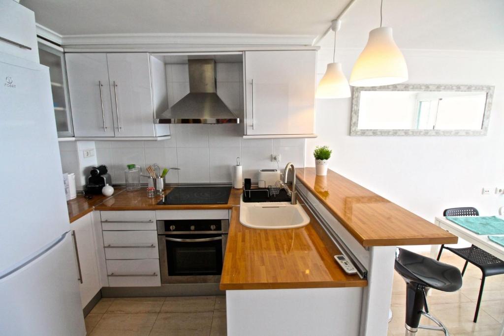 A kitchen or kitchenette at Loft Playa Muchavista