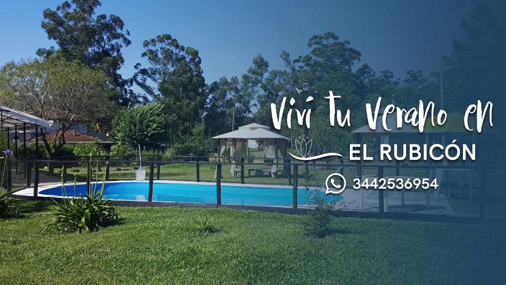a sign for a villa with a swimming pool at El Rubicón (casa de campo) in Concepción del Uruguay