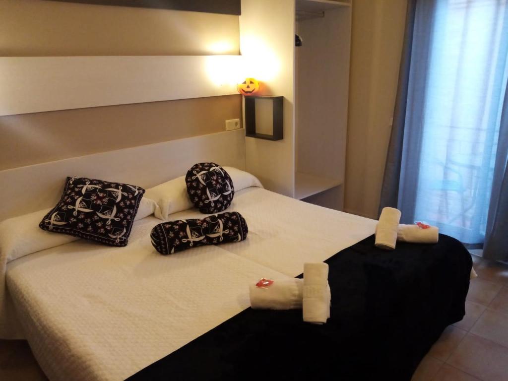 Postel nebo postele na pokoji v ubytování Hostal Termes