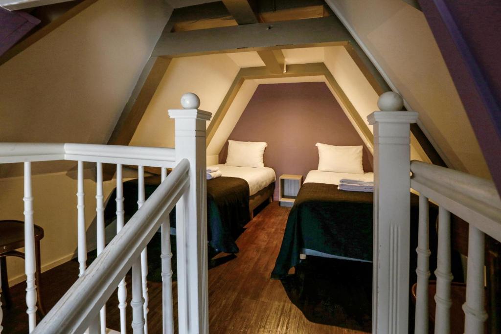 Postel nebo postele na pokoji v ubytování City Hotel Amsterdam