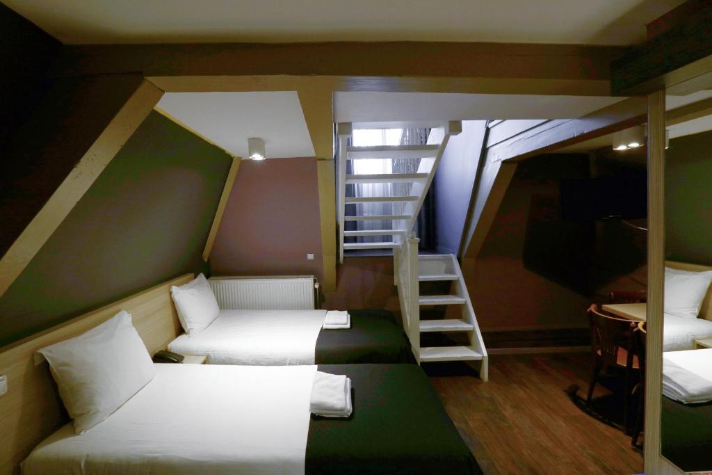 Postel nebo postele na pokoji v ubytování City Hotel Amsterdam