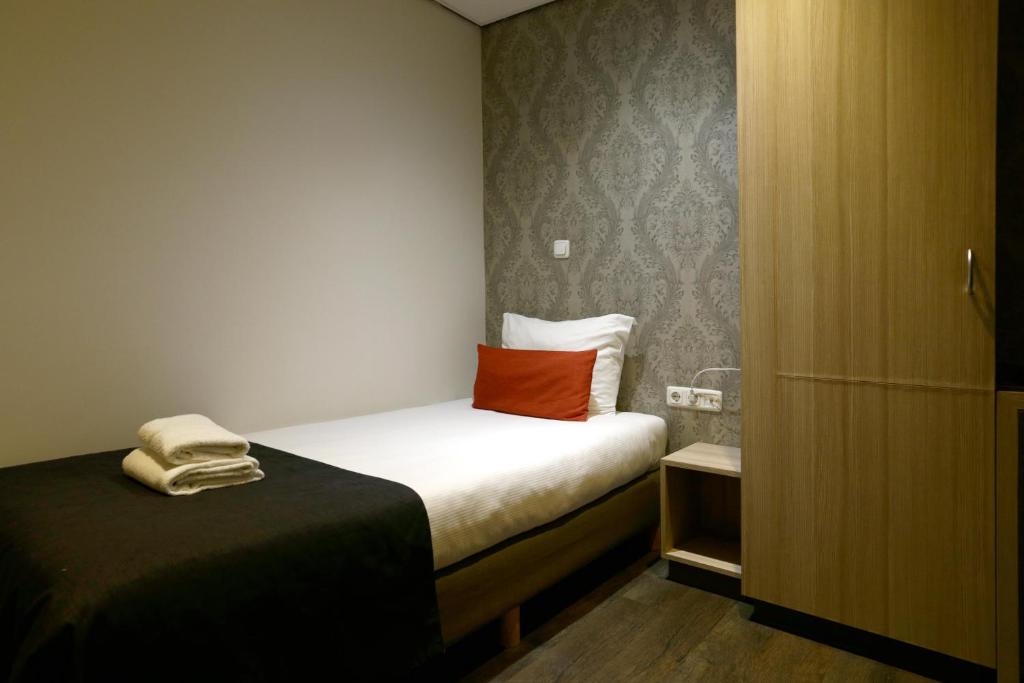 Postel nebo postele na pokoji v ubytování City Hotel Amsterdam
