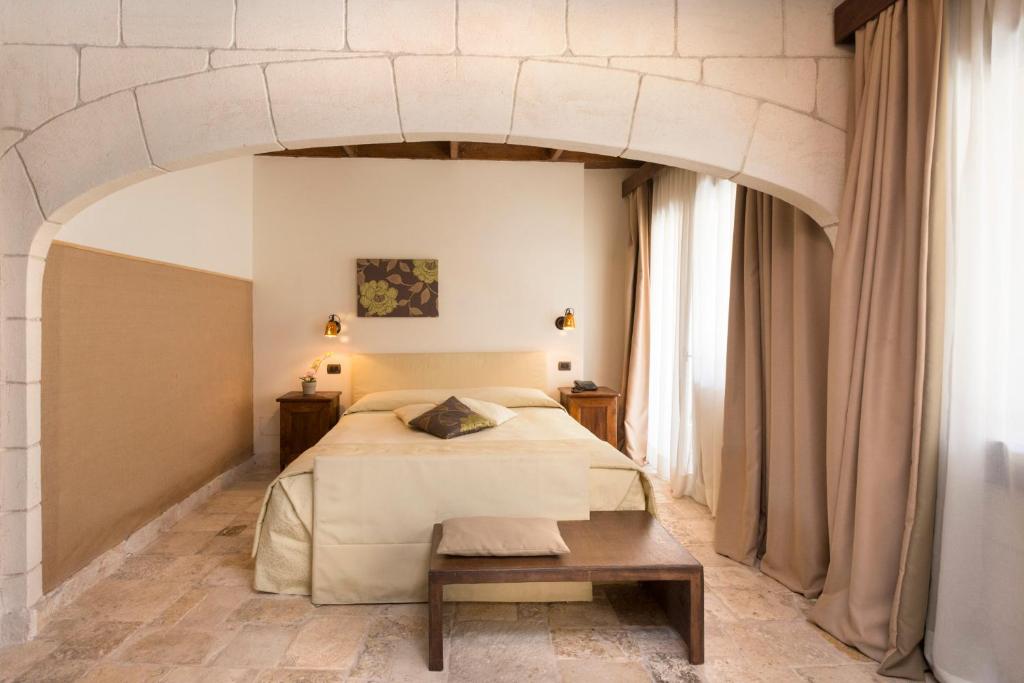 Postel nebo postele na pokoji v ubytování UNA HOTELS Regina Bari