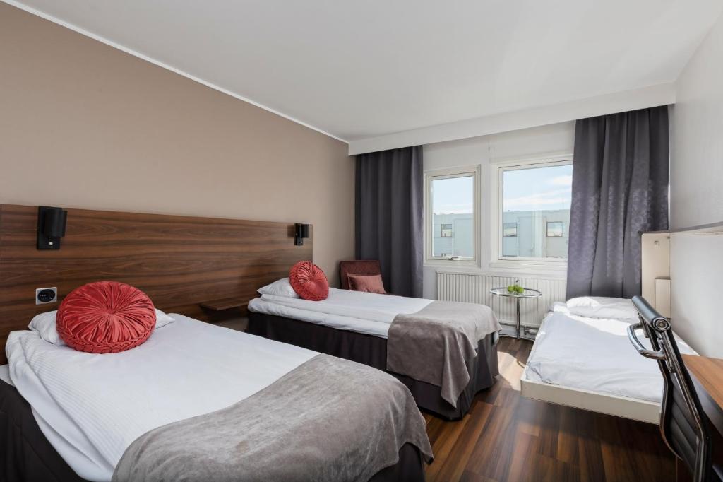 Postel nebo postele na pokoji v ubytování Apple Hotel & Konferens Göteborg