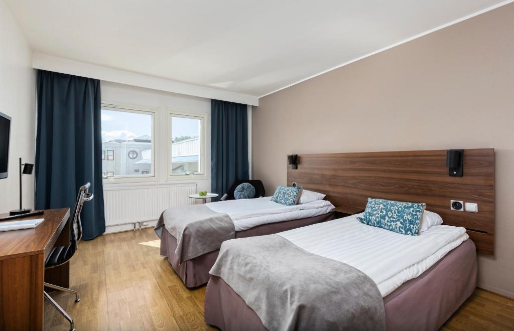 Postel nebo postele na pokoji v ubytování Apple Hotel & Konferens Göteborg