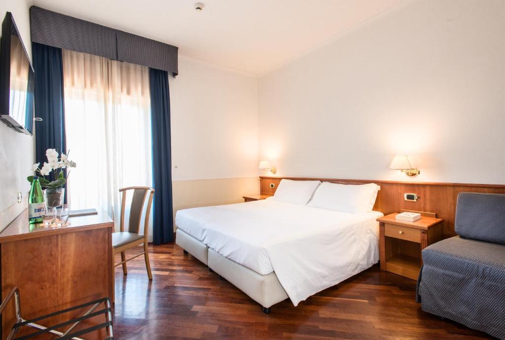 Postel nebo postele na pokoji v ubytování Atlantic Park Hotel