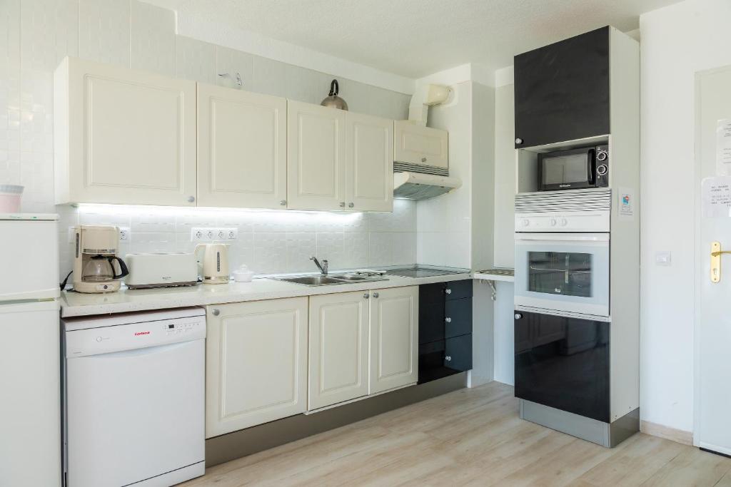 Kuchyň nebo kuchyňský kout v ubytování Apartamento Villa Cancun