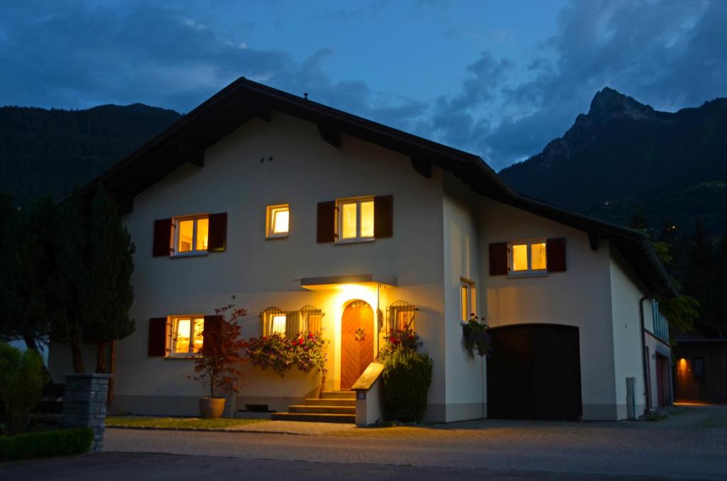 a house with its lights on at night at Panoramablick in Schruns-Tschagguns