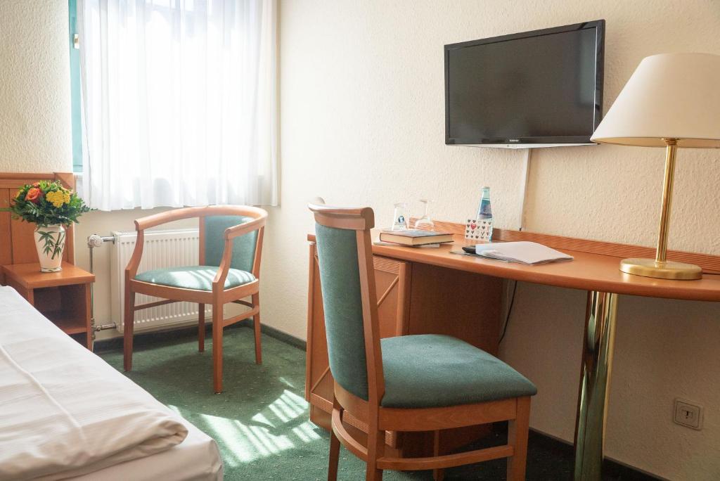 TV a/nebo společenská místnost v ubytování Hotel Adagio