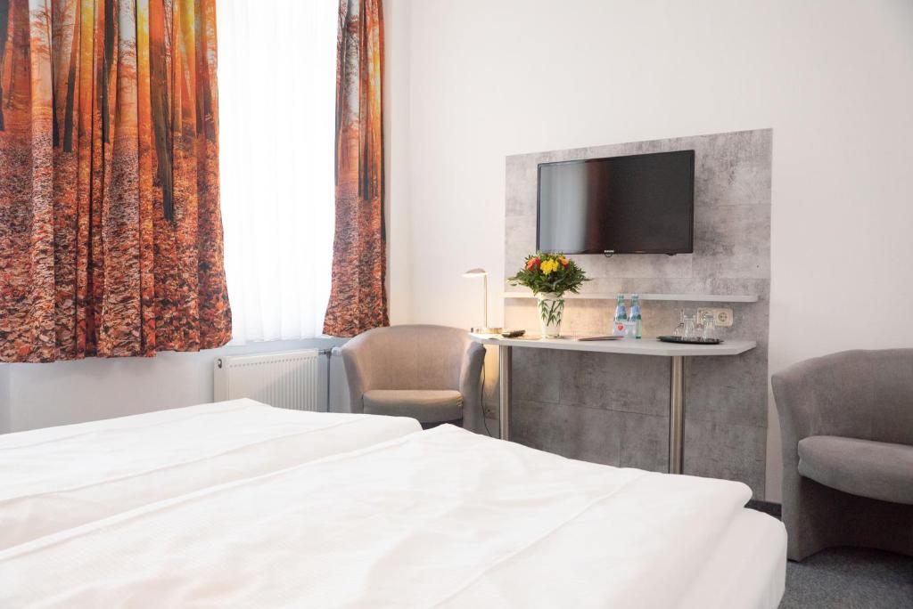 Postel nebo postele na pokoji v ubytování Hotel Adagio