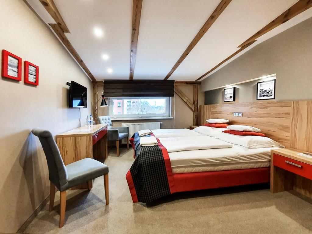 Кровать или кровати в номере Kamienica Morska Gdynia
