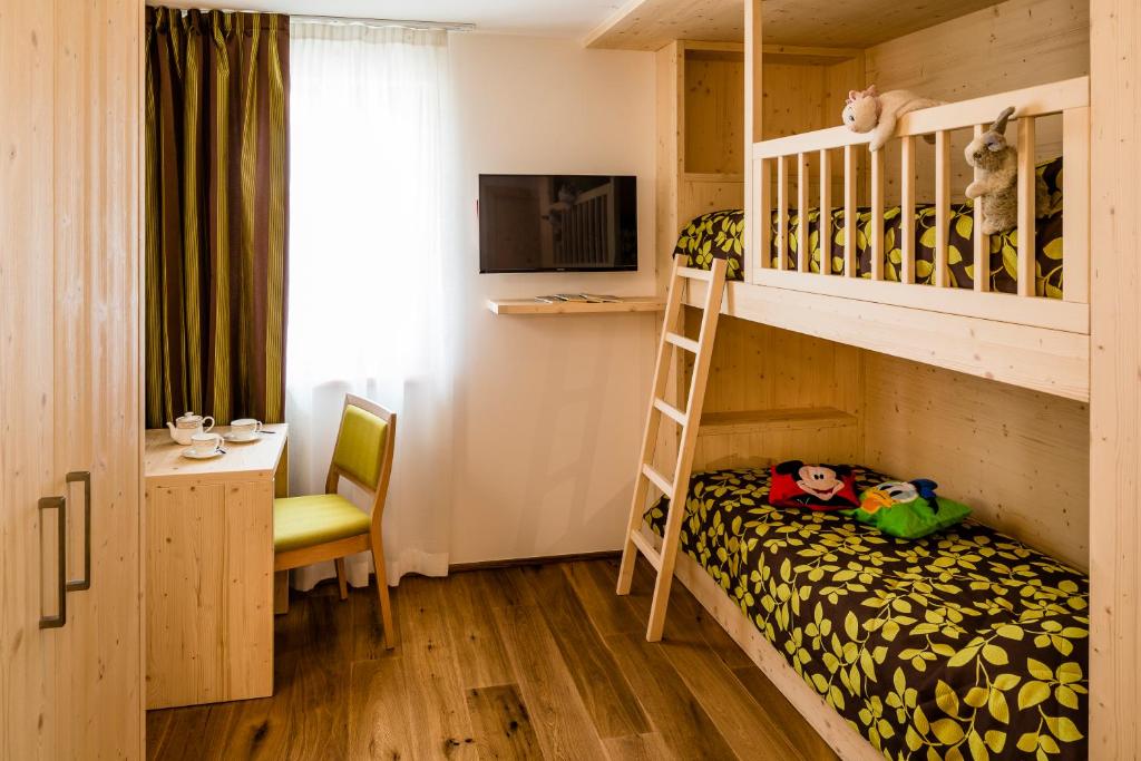 Postel nebo postele na pokoji v ubytování Family Hotel Serena