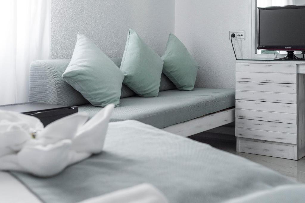 Postel nebo postele na pokoji v ubytování Hostal Bellavista Formentera