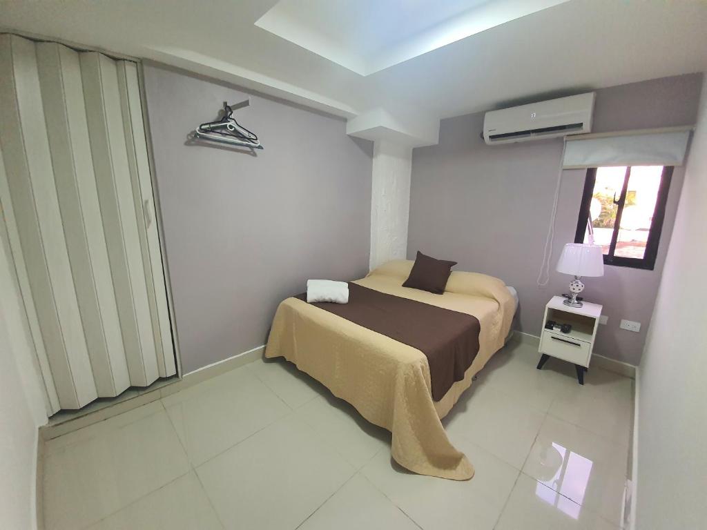 Postel nebo postele na pokoji v ubytování Malecon Premium Rooms & Hotel