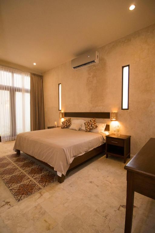 Una cama o camas en una habitación de Hotel Boutique SAYAB