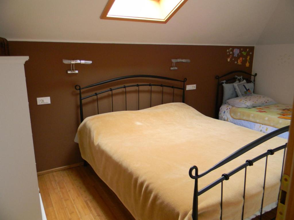Postel nebo postele na pokoji v ubytování Apartments Lorenco