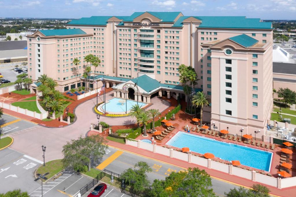 an aerial view of a resort with a pool at The Florida Hotel & Conference Center in the Florida Mall in Orlando