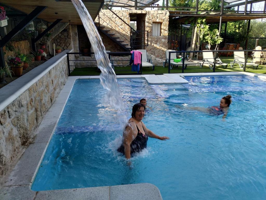 The swimming pool at or close to Posada Rural SPA Granja LA TEJERA de Lozoya