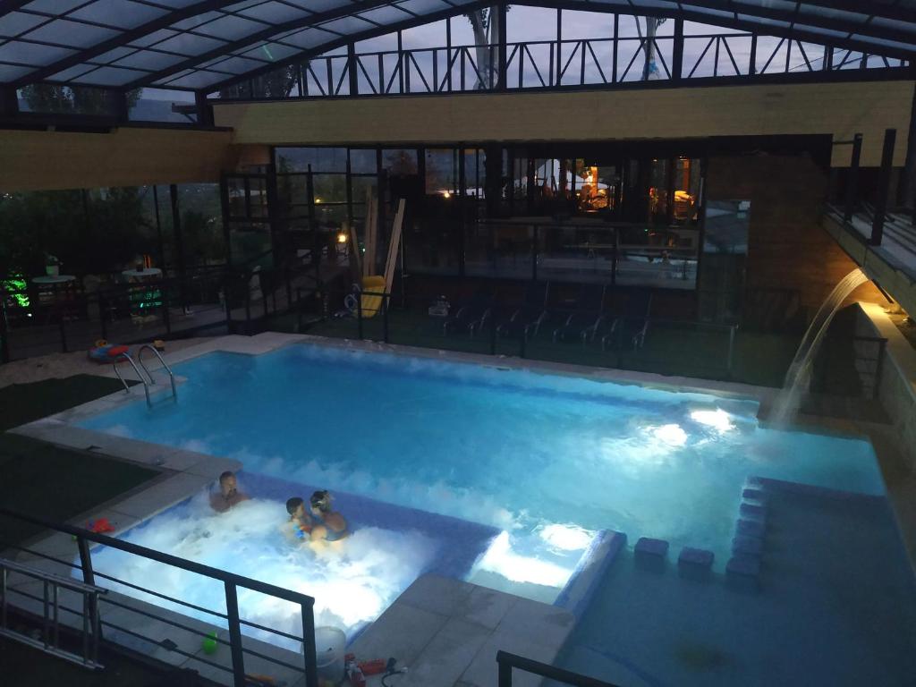 The swimming pool at or close to Posada Rural SPA Granja LA TEJERA de Lozoya