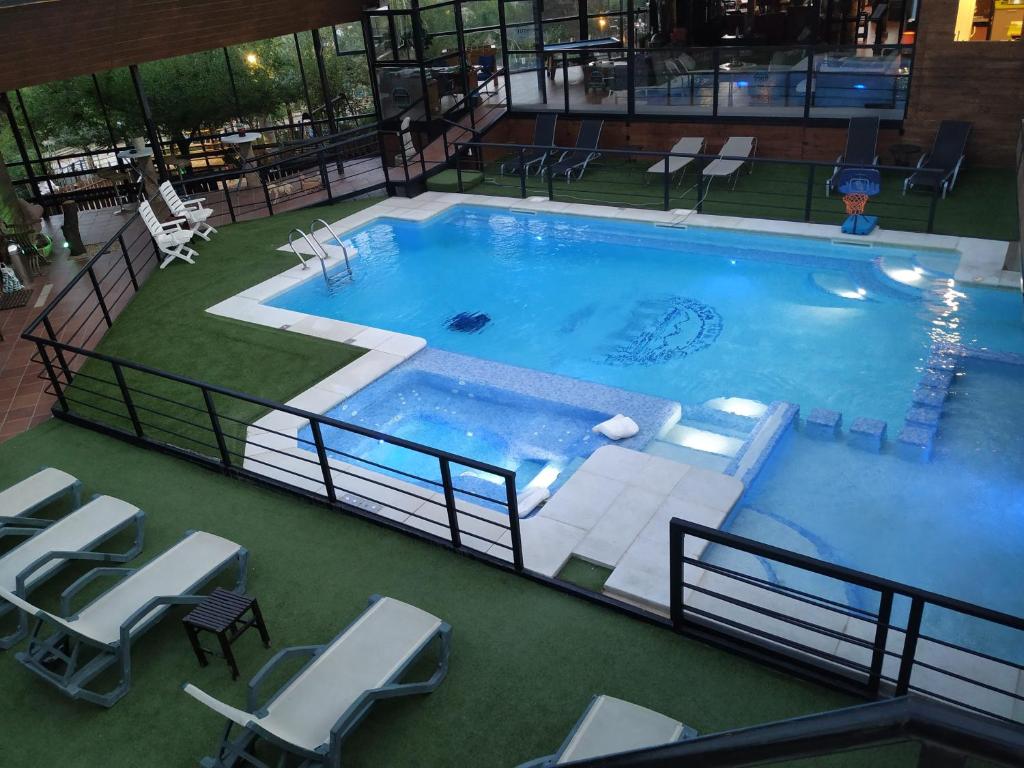 The swimming pool at or close to Posada Rural SPA Granja LA TEJERA de Lozoya