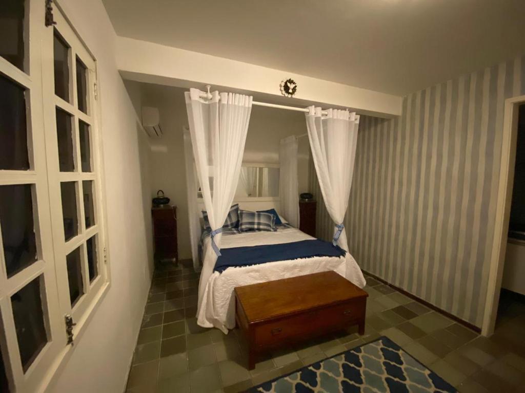 En eller flere senge i et værelse på Casa praia Porto de Galinhas Toquinho