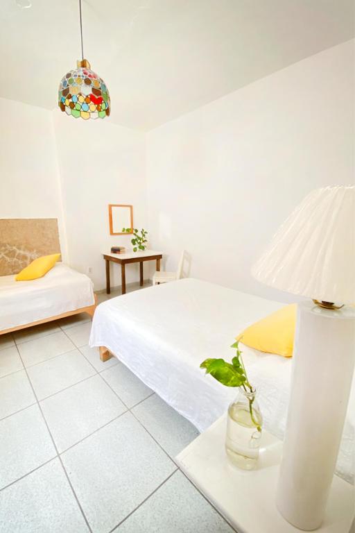Postel nebo postele na pokoji v ubytování Casa Canario Hostel