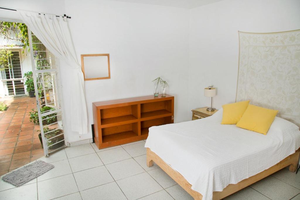 Postel nebo postele na pokoji v ubytování Casa Canario Hostel