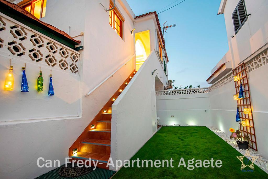 a staircase in a house with a green lawn at Can Fredy - Private Apartment Agaete in Agaete