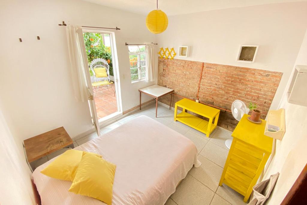 Postel nebo postele na pokoji v ubytování Casa Canario Hostel