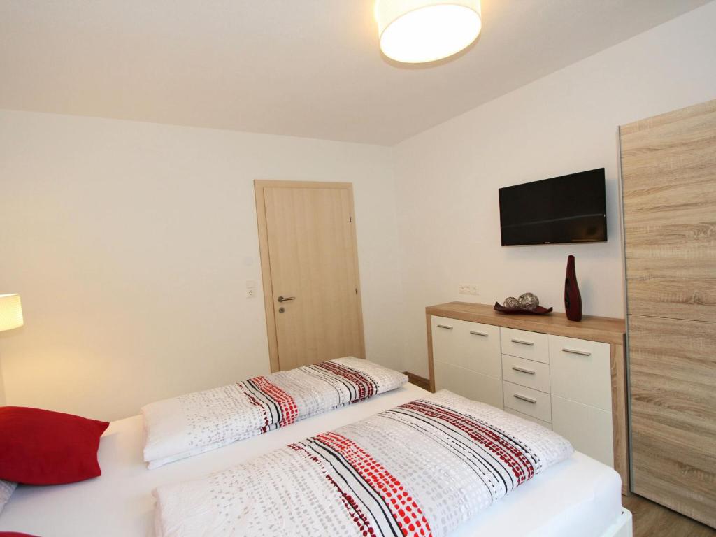 Postel nebo postele na pokoji v ubytování Apartment in Schwendau near Horbergbahn